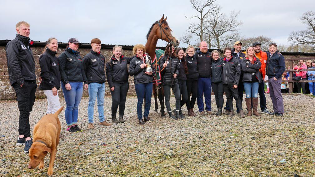 Team Corach: staff at Lucinda Russell and the seven-strong syndicate The Ramblers pose with the Grand National hero at his homecoming