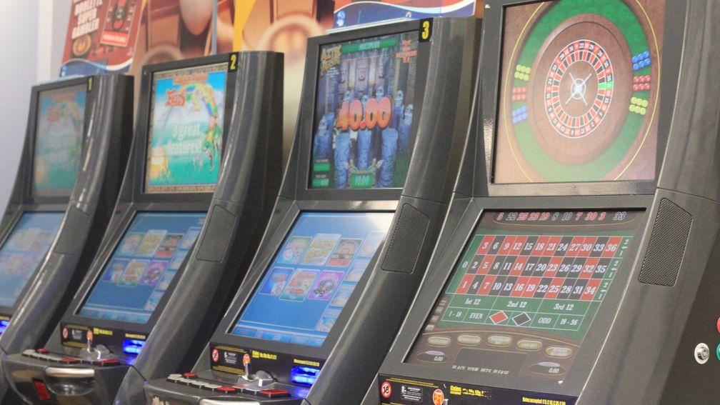 Defendants charged with wrecking betting shop machines: