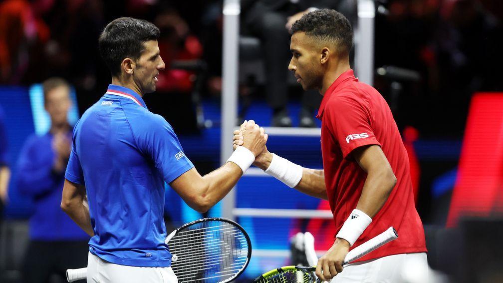 Felix Auger Aliassime and Novak Djokovic shake hands after their Laver Cup clash last month