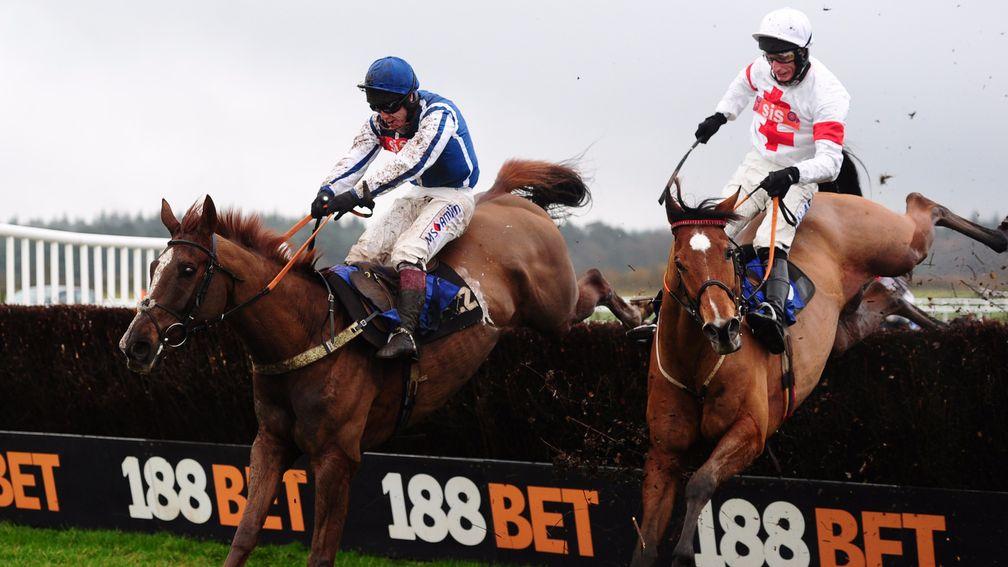 Flaming Charmer (left) puts in a flying leap at the last to deny Dance Floor King at Exeter