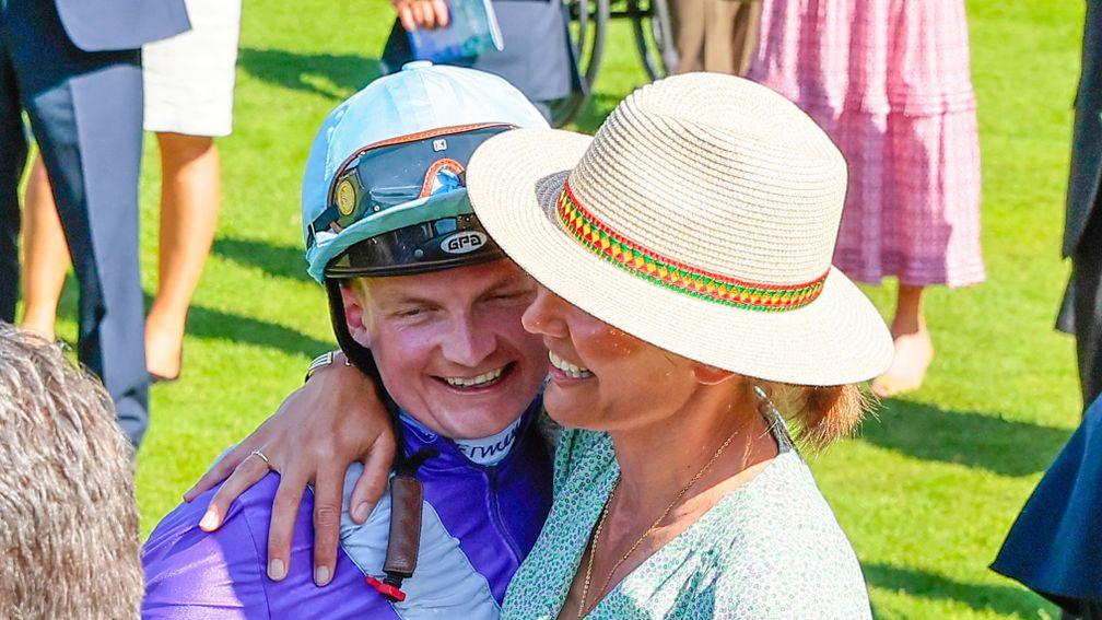 Rob Hornby gets a hug from trainer Andrew Balding's wife Anna Lisa after his success on Alcohol Free in the July Cup