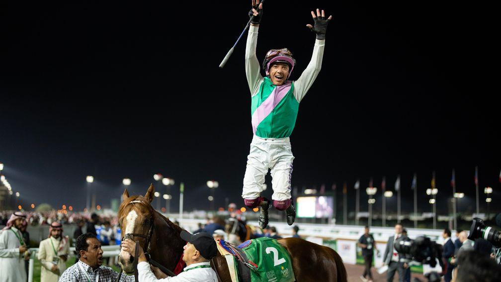 Frankie Dettori pulls off his famous dismount after victory on Elite Power