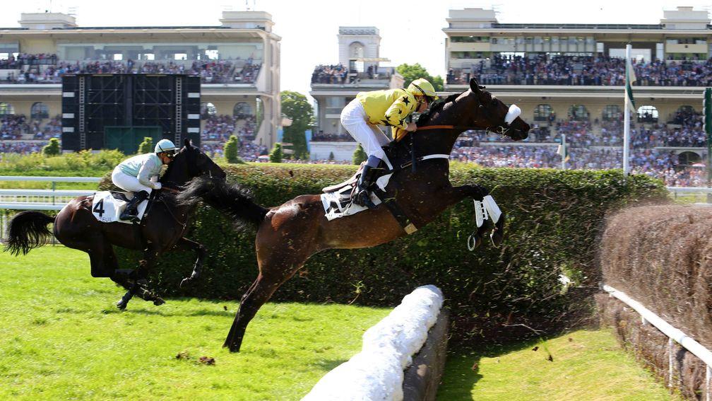 Juge de Paix: the Grand Steeple-Chase field are already well past three-quarters of the race by the time they jump the biggest fence at Auteuil