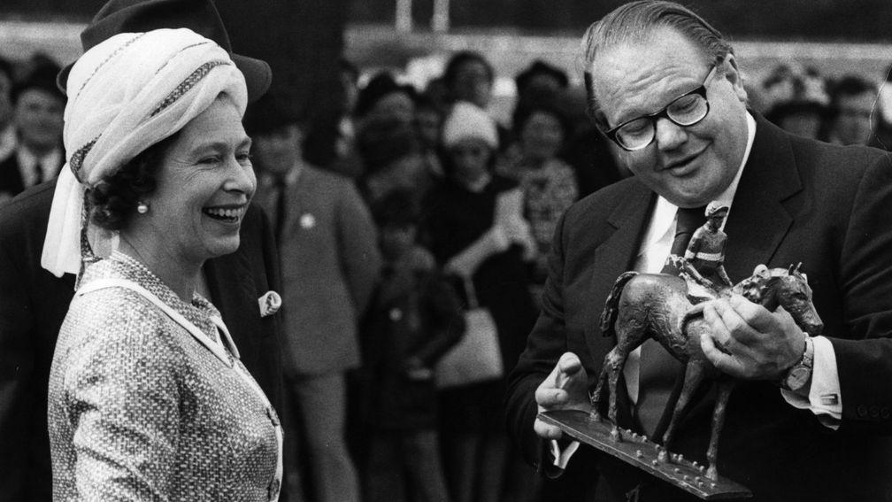 The Queen, pictured here with Nelson Bunker Hunt in 1974, presented the King George trophy