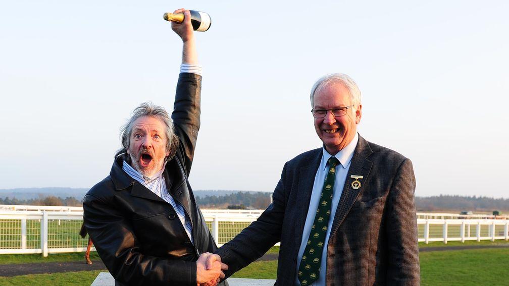 Drinks are on me: Steve Whiteley celebrates his Jackpot success as he receives a bottle of champagne from Exeter chairman Jeremy Colson