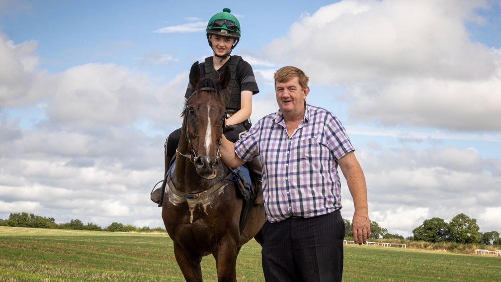 John Shark Hanlon with son Paddy onboard stable star Hewick after his first day back in work.Duninga GallopsPhoto: Patrick McCann/Racing Post23.08.2022