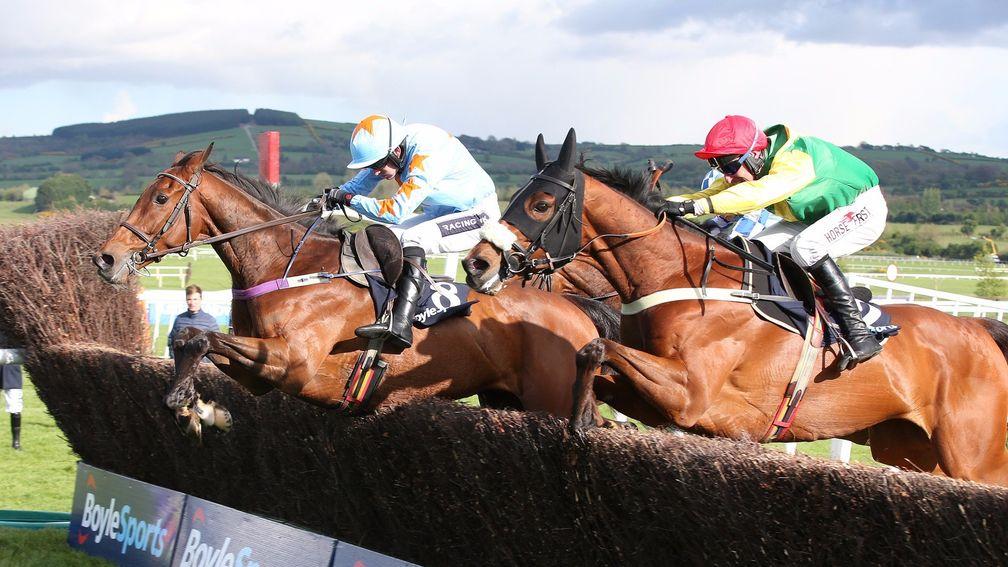 Fox Norton and Robbie Power (right) take the last with Un De Sceaux and Ruby Walsh in their sights