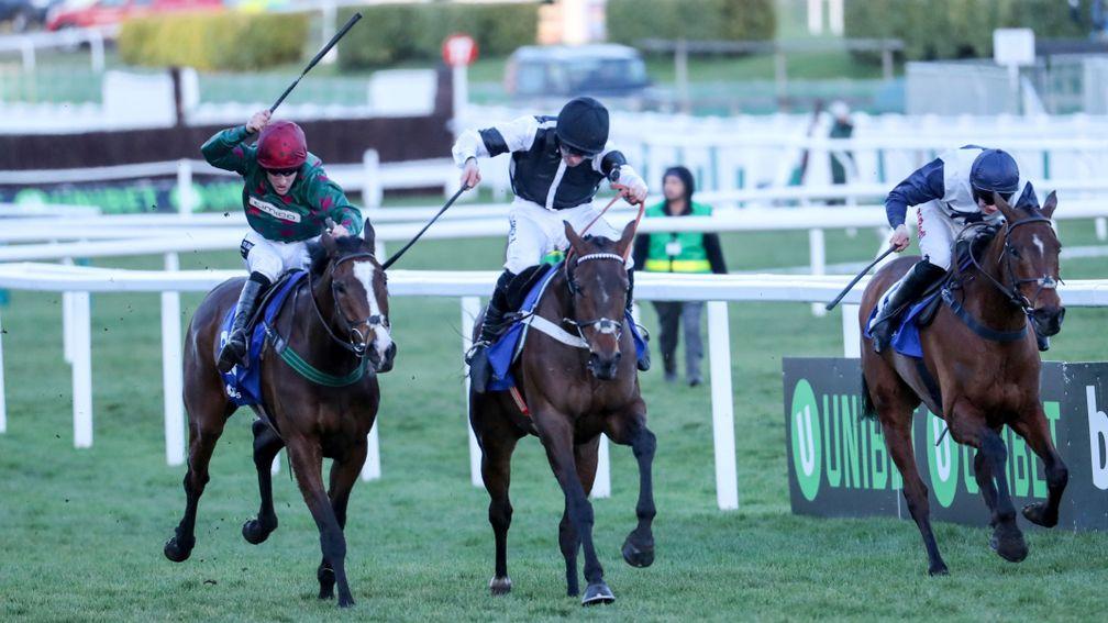 Mister Whitaker (Brian Hughes, left) slugs it out with Rather Be (centre) and Rocklander to land the Close Brothers Novices' Handicap Chase at Cheltenham in March