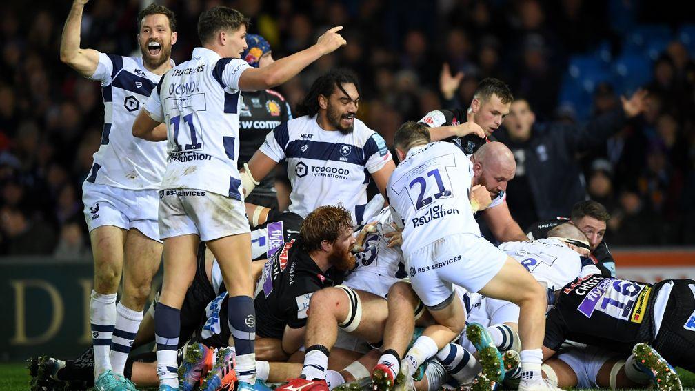 Bristol Bears players celebrate the late try that gave them victory at Exeter on Sunday