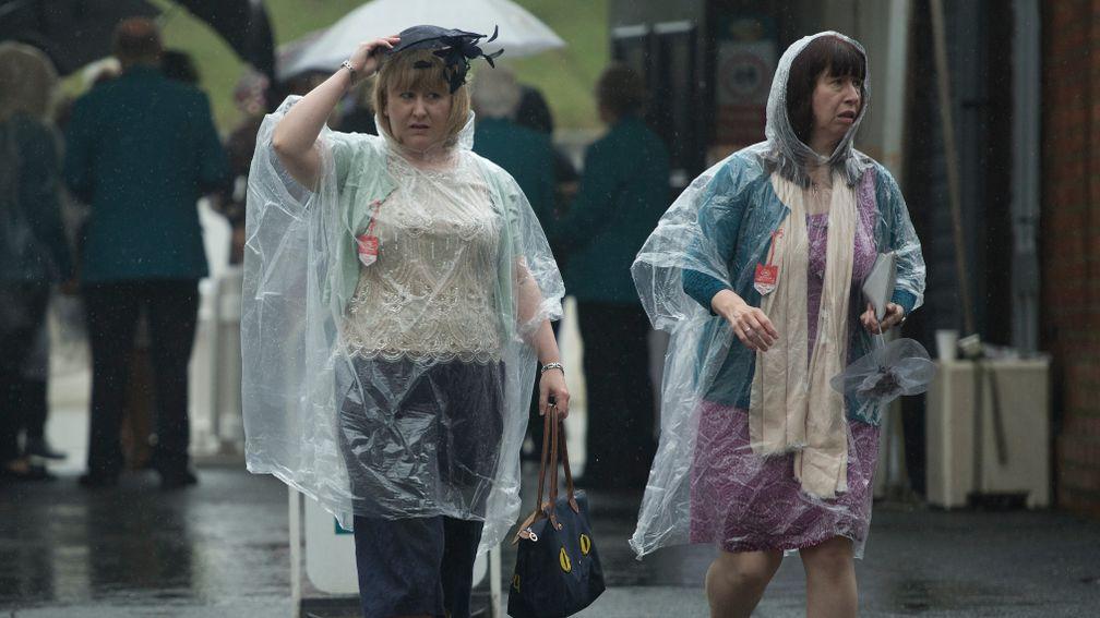 Racegoers get a soaking arriving on the Knavesmire on Wednesday