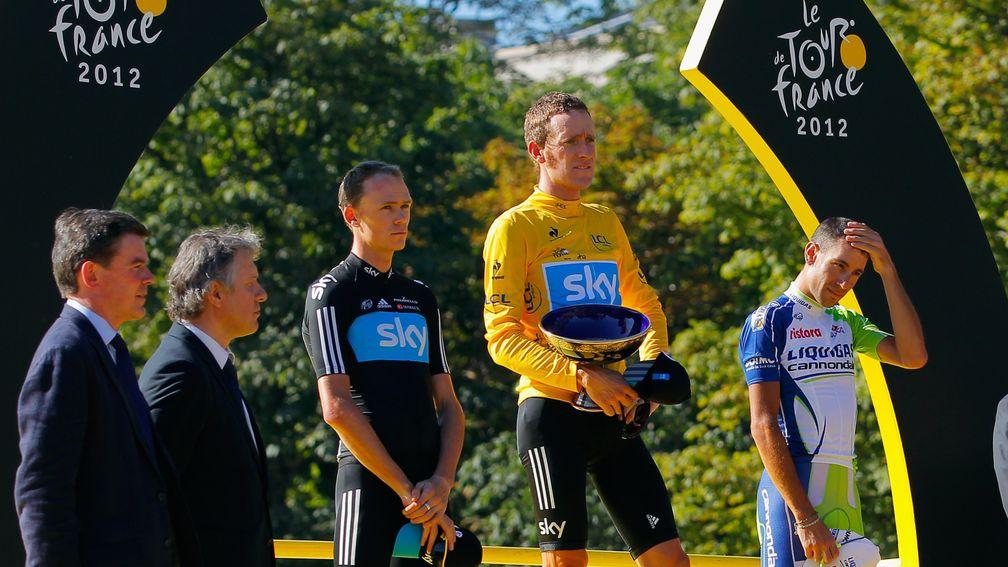 Bradley Wiggins and Chris Froome stand on the podium after their Tour de France heroics