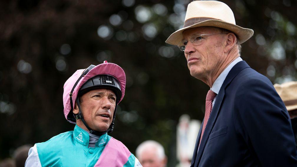 John Gosden hits Frankie Dettori on his cap after the jockey had performed his flying dismount from Logician when winning the Great Voltigeur StakesYork 21.8.19 Pic: Edward Whitaker