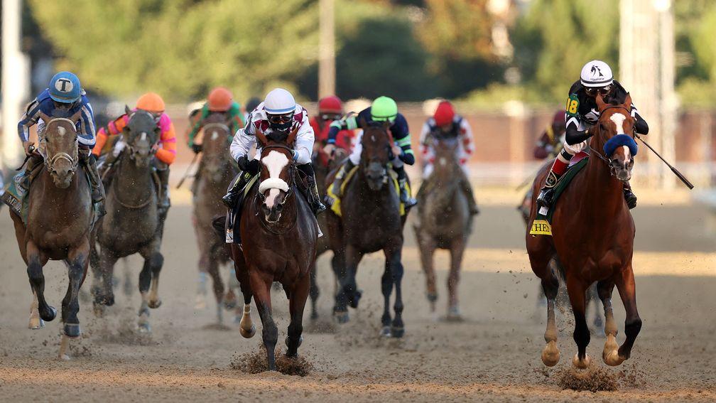 Authentic (right) pulls away from Tiz The Law at Churchill Downs