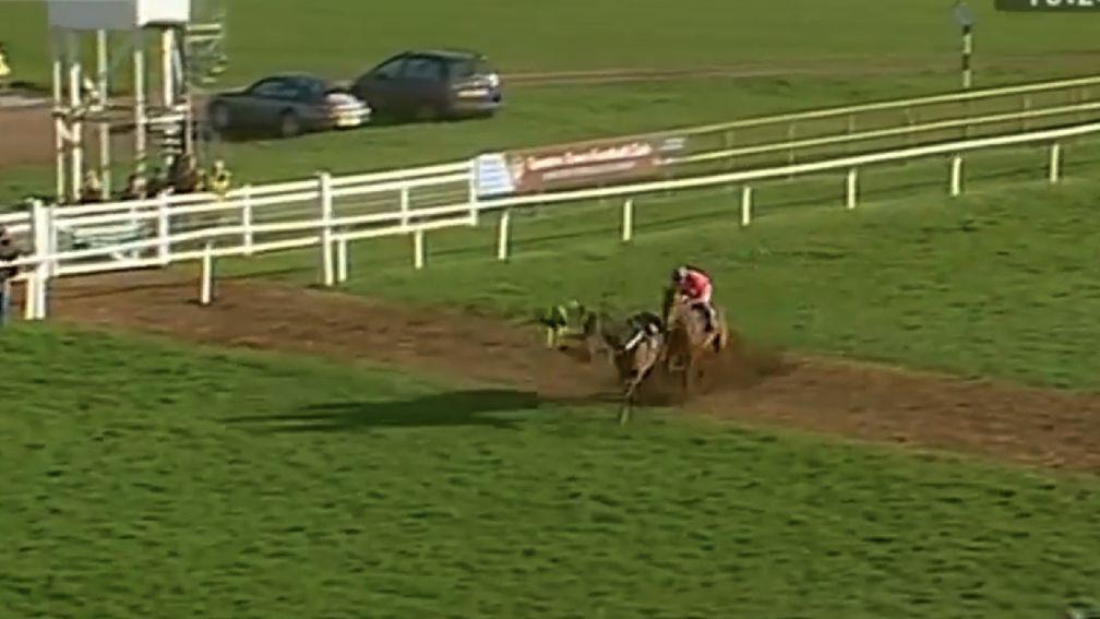 The helpless jockey is sent crashing to the turf as a result of the favourite's sudden jolt