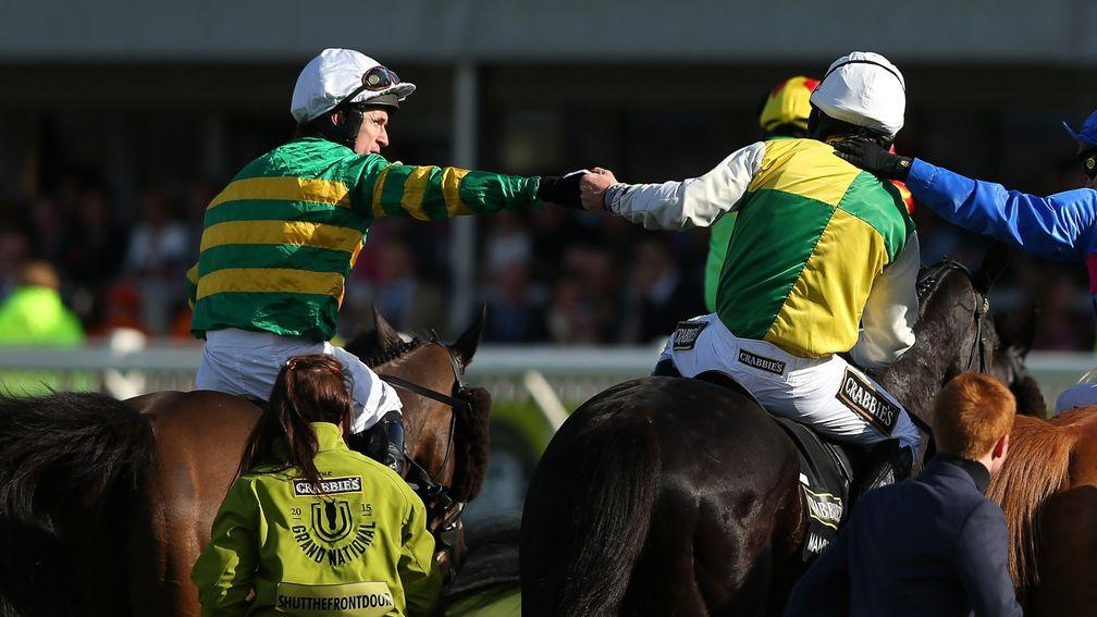 Sir Anthony McCoy (left) congratulates Leighton Aspell after he won the Grand National on Many Clouds in 2015