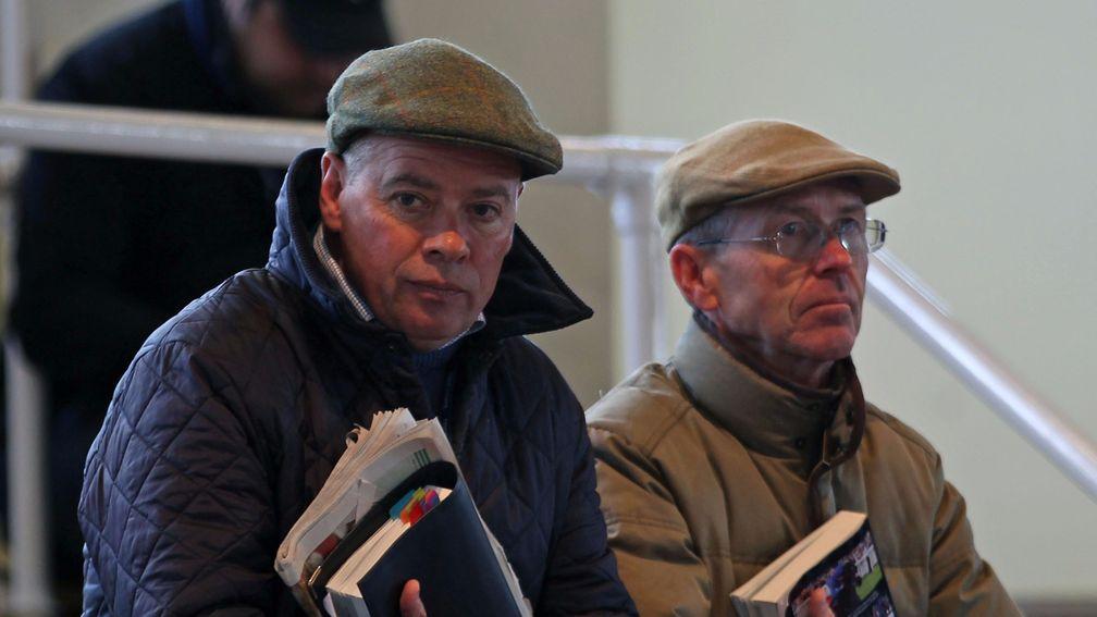 Clive Cox (left) and John Reid survey the ring at Tattersalls