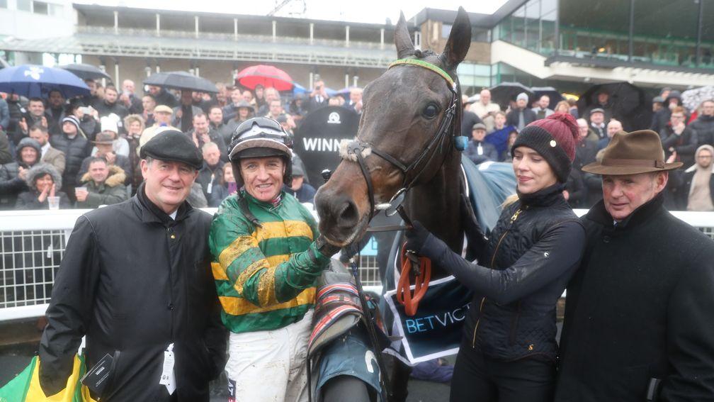 Buveur D'Air and Barry Geraghty in the winner's enclosure with owner JP McManus and his racing manager Frank Berry (right)