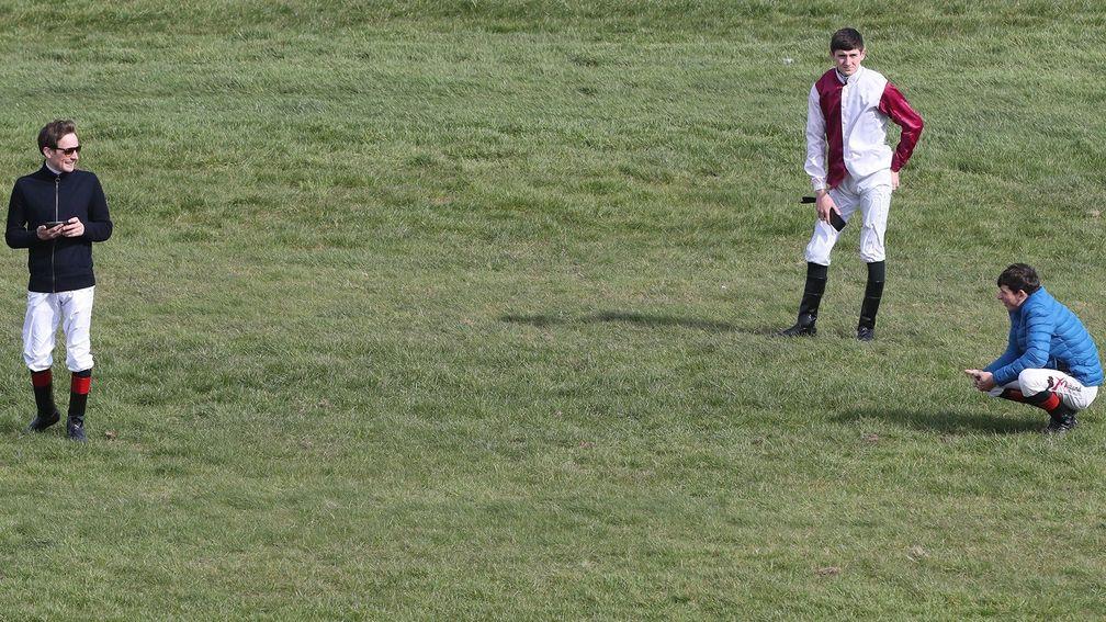 Jockeys at Naas practice social distancing before racing is eventually cancelled