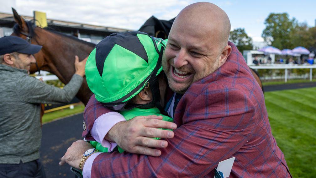 Shane Foley gets an appreciative hug from owner Gary Robinson following Galeron's victory