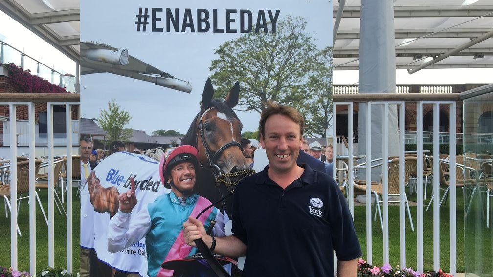 William Derby poses for a picture at the Enable selfie wall