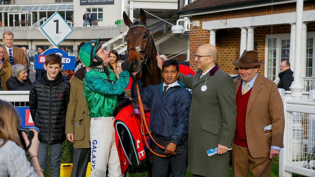 Daryl Jacob casts an admiring glance at Scilly Isles winner Top Notch, while joint-owner Simon Munir (second from the right) does the same