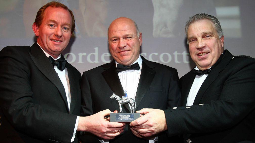 Proud owners Jim Edgar (centre) and Les Donaldson (right) receive the Outstanding Sprinter award for Borderlescott at the 2008 ROA Awards