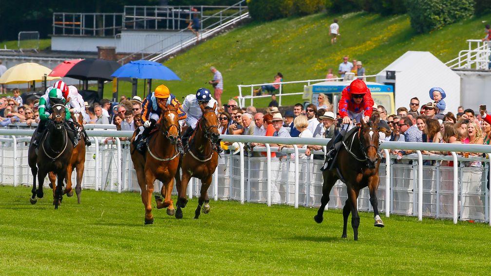 Natalie's Joy (right) clears away from her rivals at Goodwood to win impressively on her debut