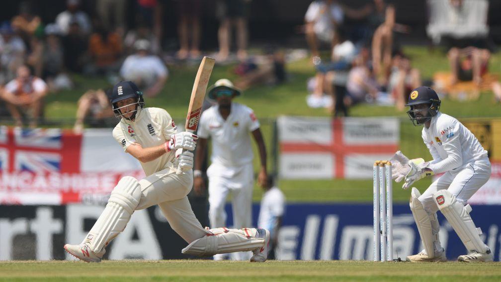 England captain Joe Root sweeps to good effect during his vital century in Pallekele