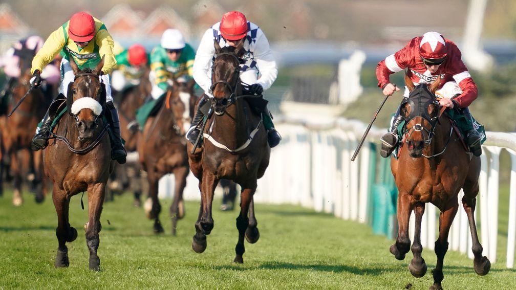 Tiger Roll (right) surges to his second Grand National win in 2019