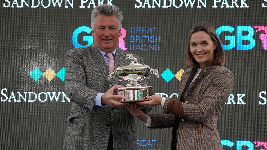 Victoria Pendleton presents trainer Paul Nicholls with his trainers' title trophy