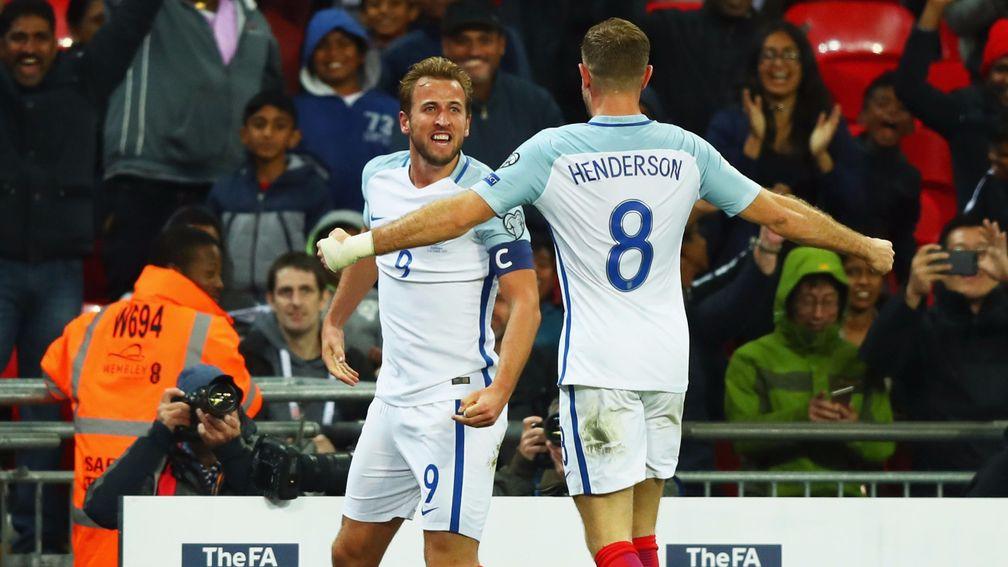 Jordan Henderson celebrates with England hero Harry Kane