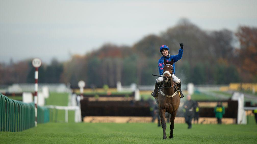 Paddy Brennan celebrates after Cue Card wins his third Betfair Chase