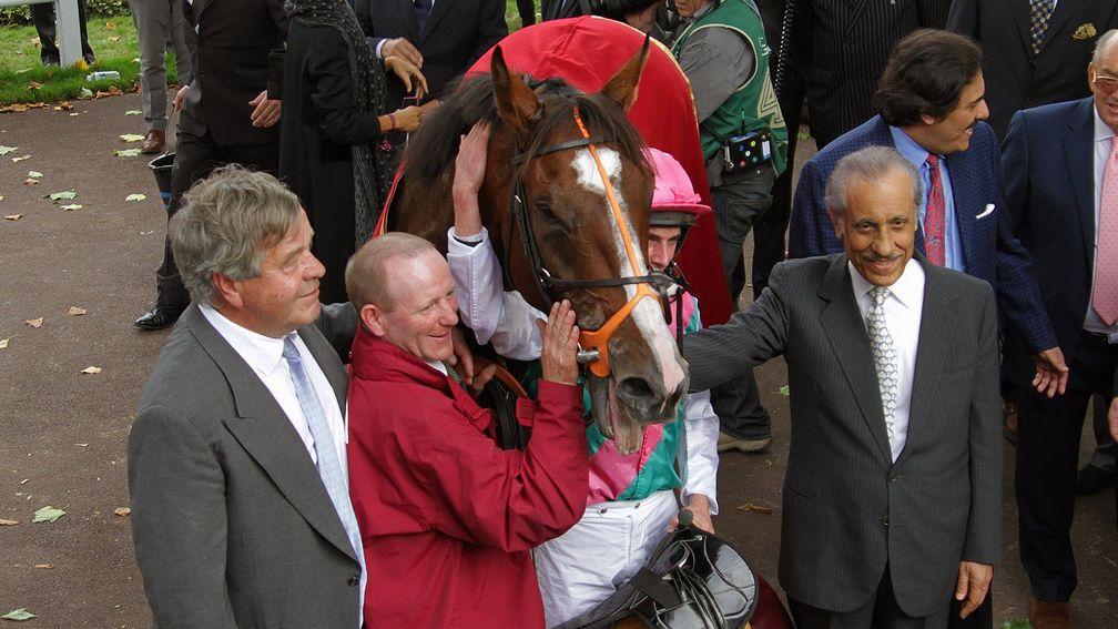 Workforce, with late owner Khalid Abdullah (right), after winning the Arc in 2010