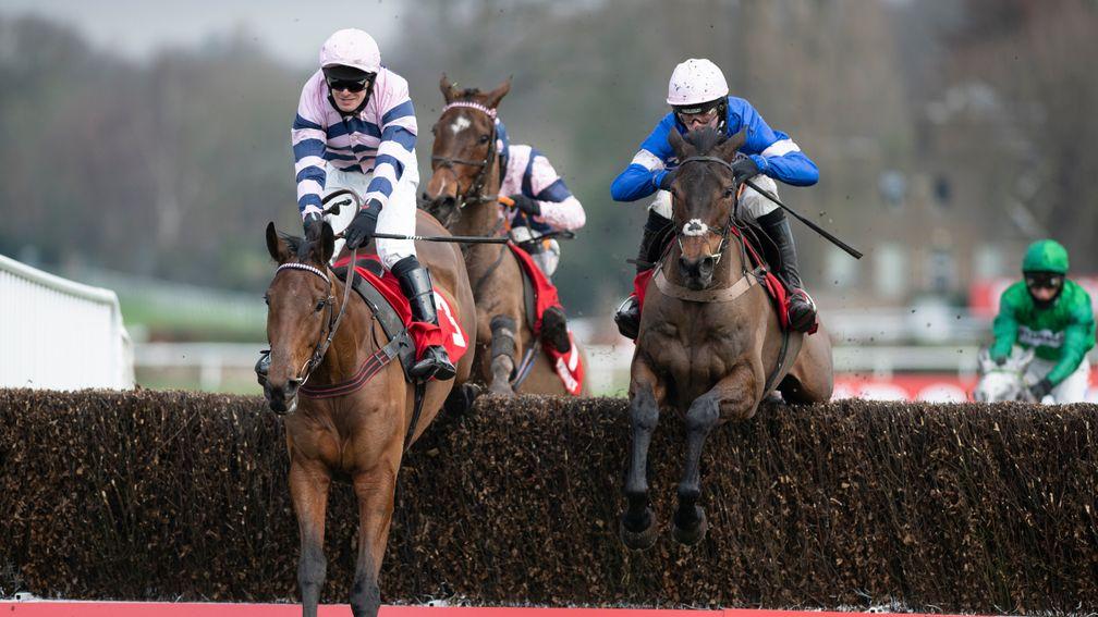 The winner Moonlighter (David Bass, left) jumps the last fence with Dolos (Harry Cobden) in the 2m handicap chaseSandown 6.2.21 Pic: Edward Whitaker/Racing Post