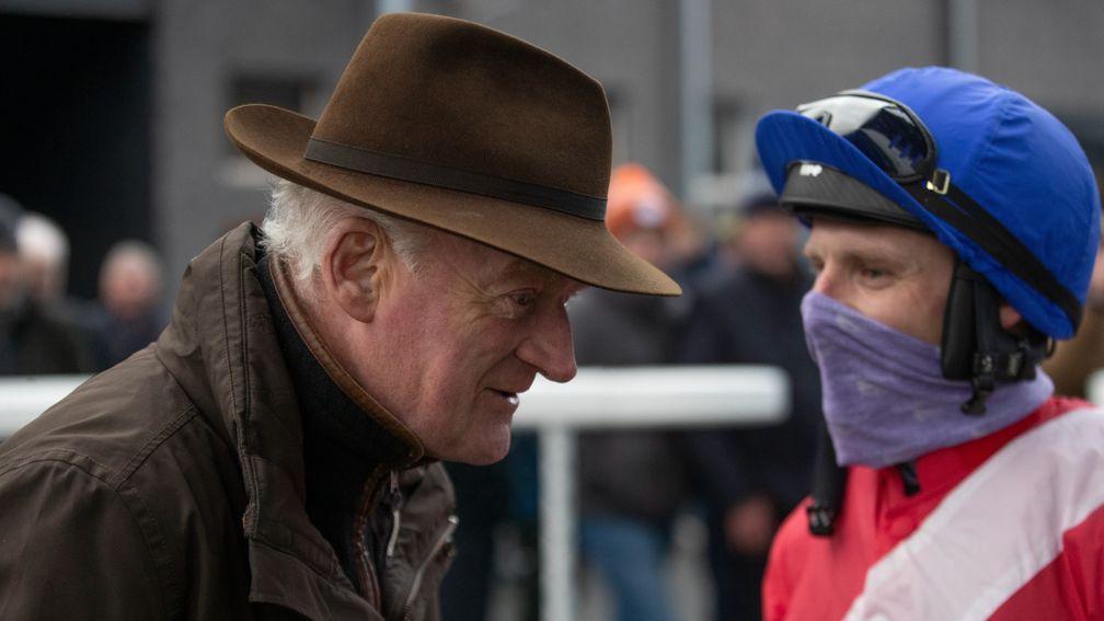 Willie Mullins (left) gets the debrief from Allaho's jockey Paul Townend