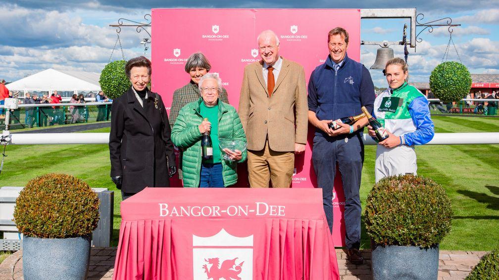 Owner Gillian Morgan is presented with the winner's prize by the Princess Royal (far left)