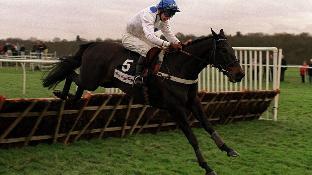 Booted and suited: Geos on the way to winning the Tote Gold Trophy in 2000 wearing protective boots on his forelegs, a practice trainer Nicky Henderson has since moved away from