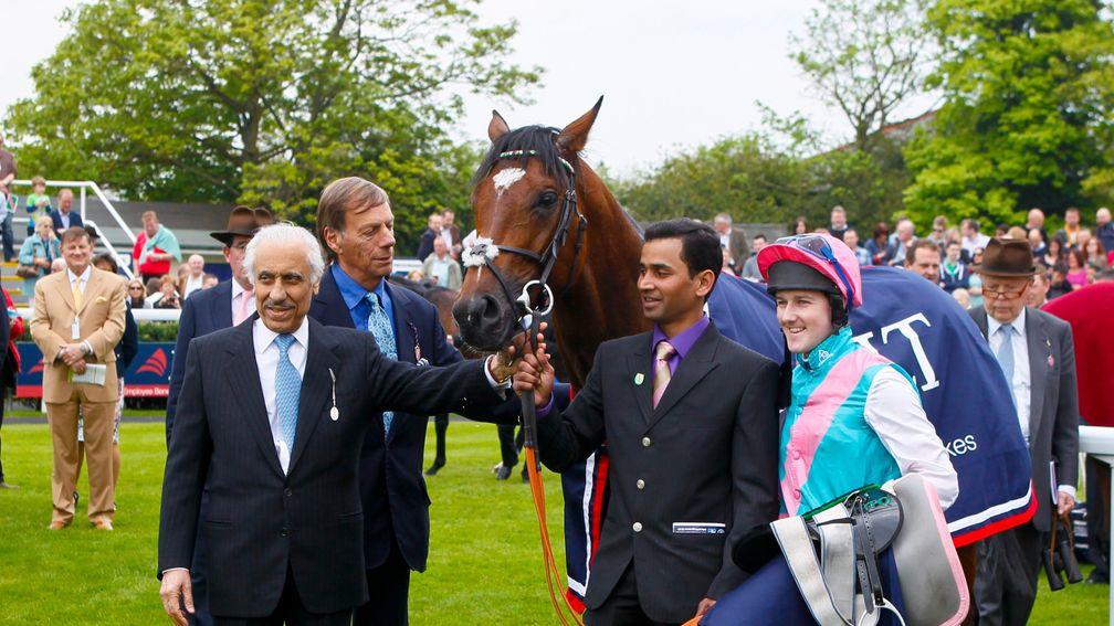 Khalid Abdulla (left) holds on to Frankel after his victory in the 2012 Lockinge Stakes