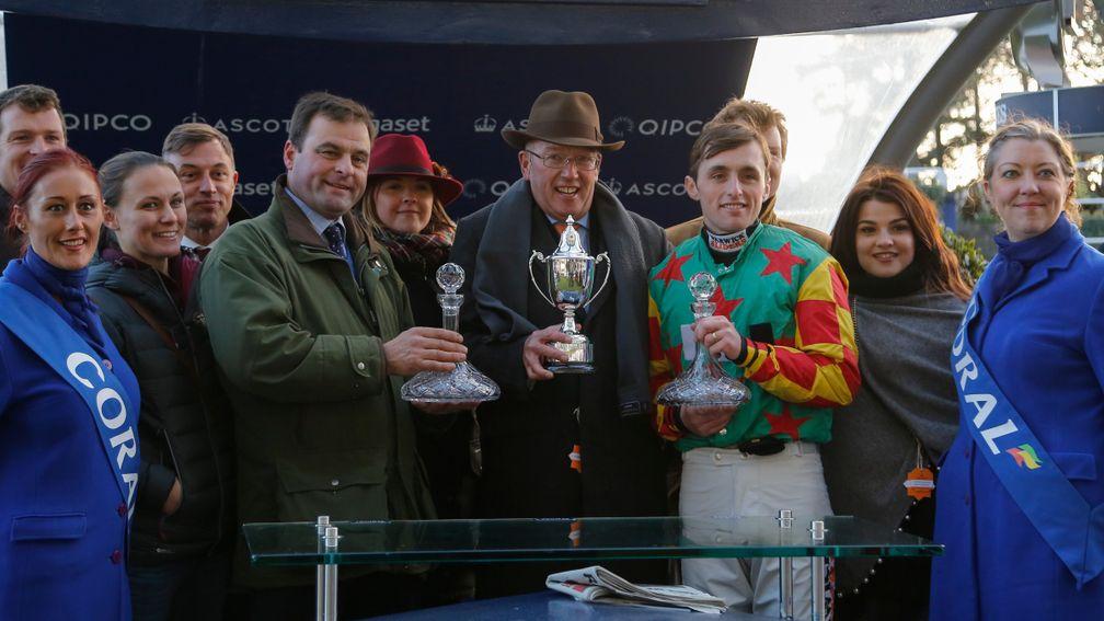 Andy Smith (brown trilby) and the other connections of Lil Rockerfeller receive the trophy after their November success at Ascot