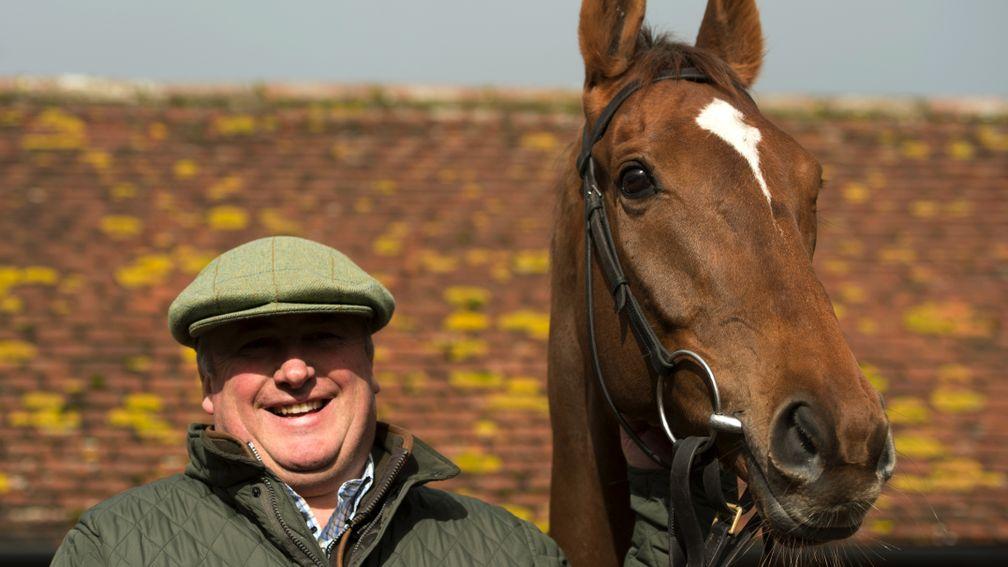 Proud trainer: Paul Nicholls and Silviniaco Conti pose in the sunshine at his Ditcheat base