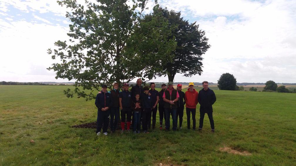 Oliver Sherwood and his team pose by the memorial tree for Many Clouds