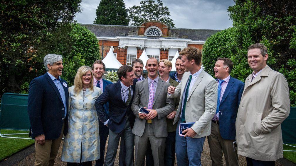 Jet Setting's connections in celebratory mood after the filly sold to Michael Wallace (right) of the China Horse Club at the Goffs London Sale