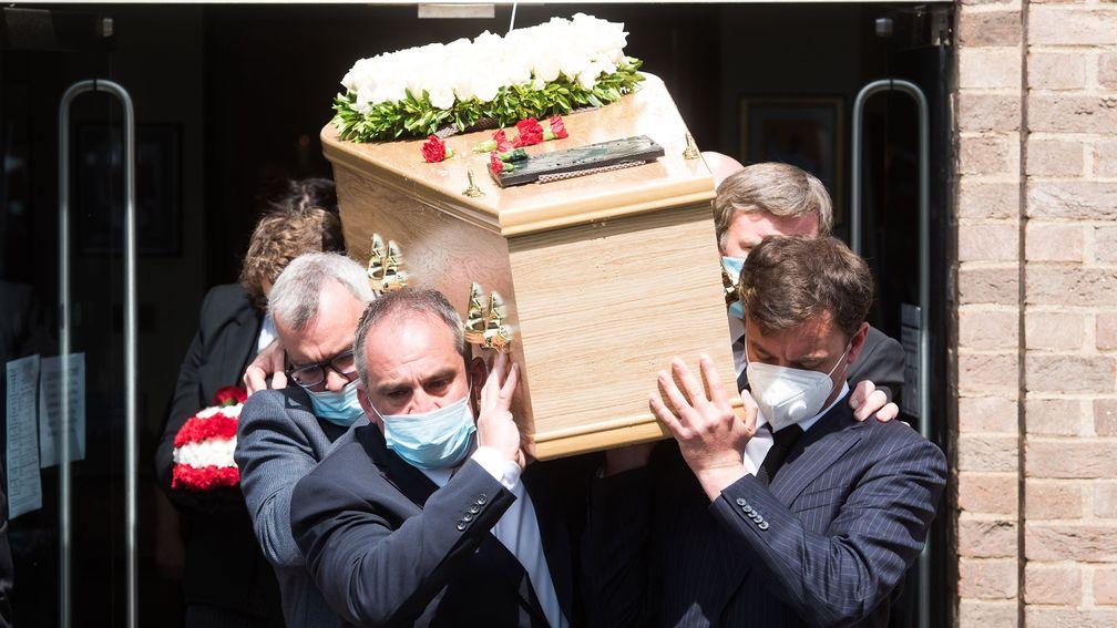 Barney Curley's coffin is carried out of the church on its way to the cemetary