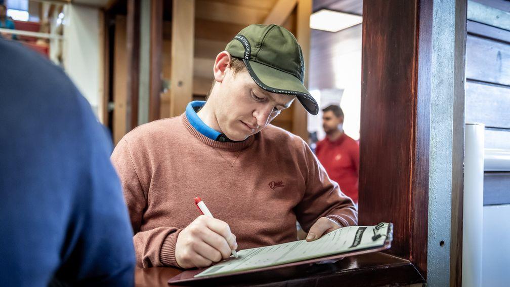 Donnchadh Doyle signs the docket at the Goffs UK Spring Sale