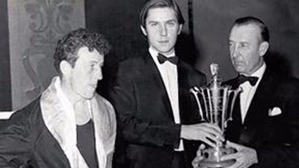 Frank Nash is presented with a trophy at the National Stable Lads boxing championships
