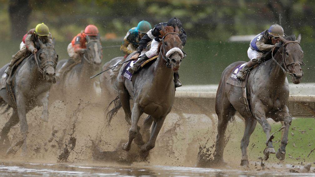The weather was appalling at Monmouth Park in 2007 as Garrett Gomez and Midnight Lure (left) make their move round the final turn to win the 2007 Sprint
