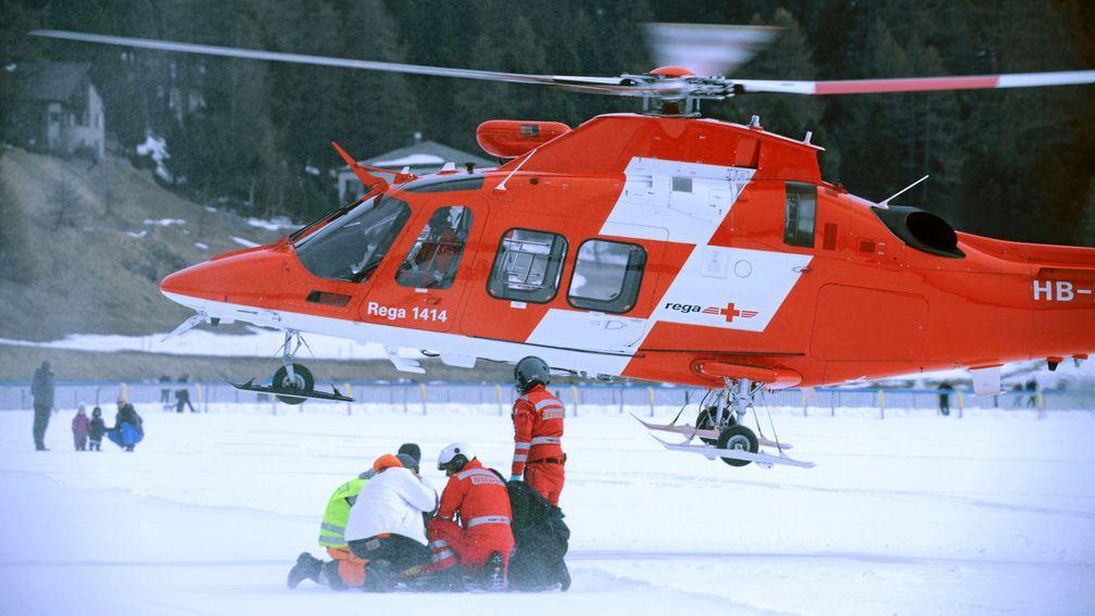 The beginning of the nightmare: Baker is airlifted to hospital after his fall at St Moritz