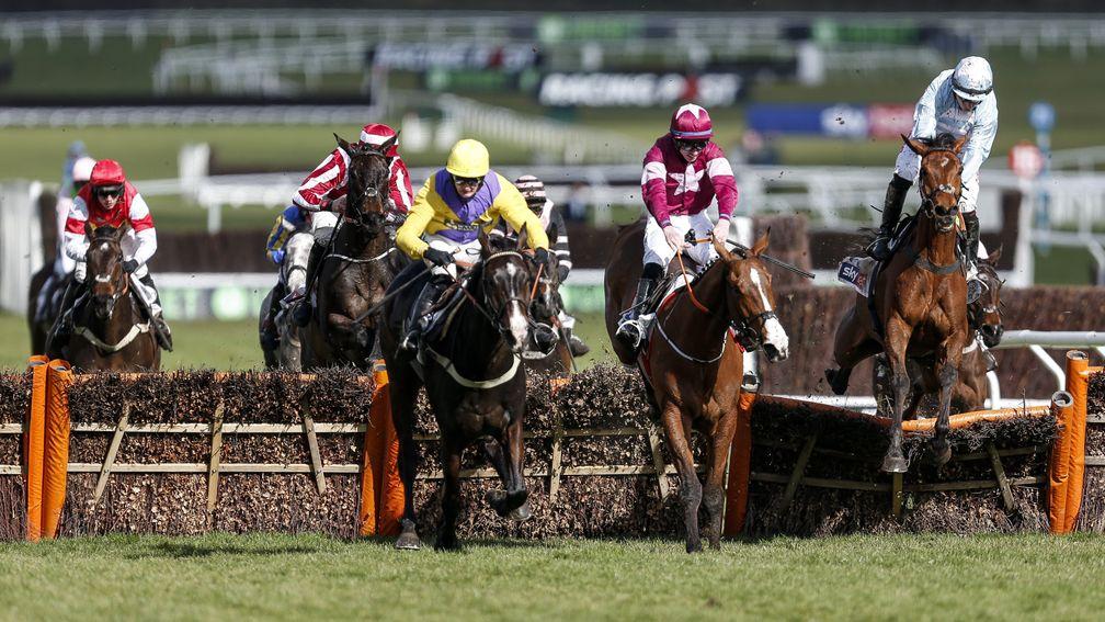 CHELTENHAM, ENGLAND - MARCH 13: Noel Fehily riding Summerville Boy (R) clear the last to win The Sky Bet Supreme Novices' Hurdle from Kalashnikov (C, yellow) at Cheltenham racecourse on Champion Day on March 13, 2018 in Cheltenham, England. (Photo by Alan