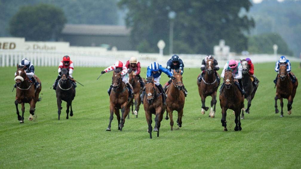 Battaash (blue and white striped cap) scores from stablemate Equilateral (pink cap) and Liberty Beach (third left)