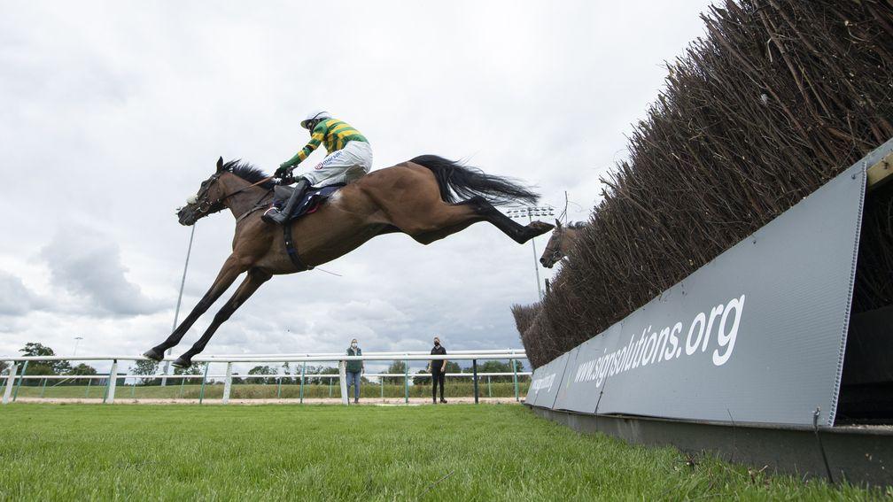 Nineohtwooneoh and Harry Cobden clear a fence en route to winning the opening race of the jumps season